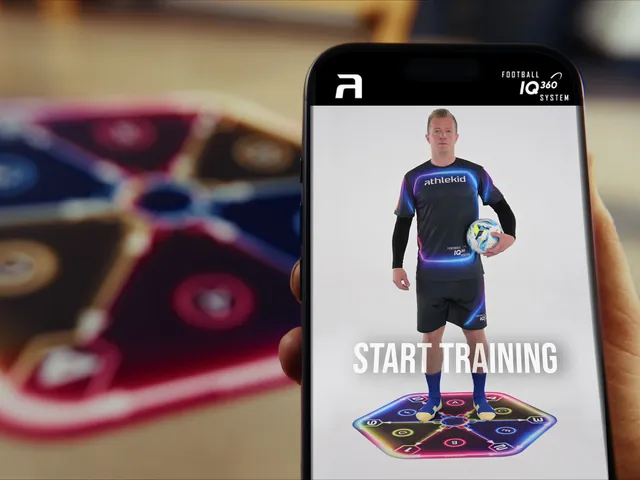 En telefon med Athlekid-appens startskærm og måtten i baggrunden